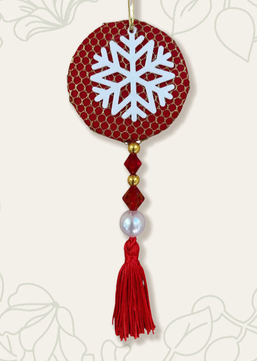 Decorative ornament with snowflake design on a red background