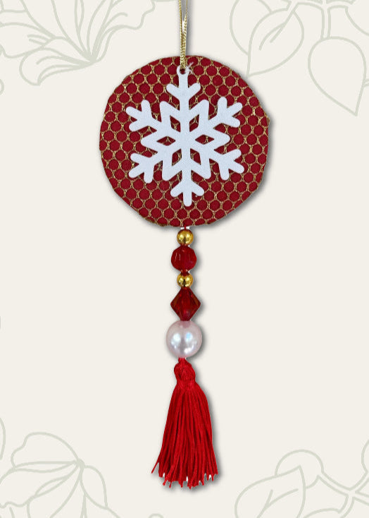 Decorative ornament with snowflake design on a red background